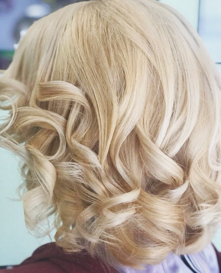 Golden blonde curls close up